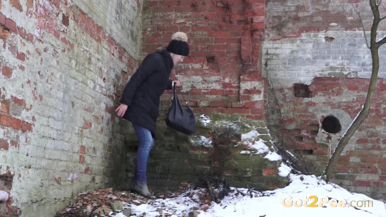 White Girl Katya Takes A Pee On Snow Covered Ground Against A Brick