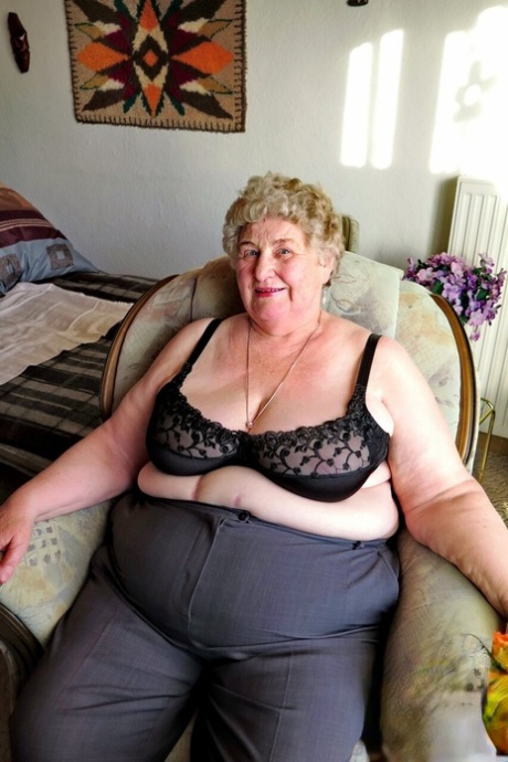 Fat Old Granny Siberia Lets Out Her Saggy Tits And Poses Naked At Her