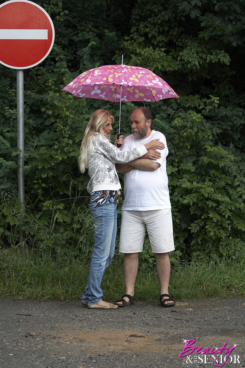 Sexy blonde teen dries off an old man caught in the rain and fucks him too  - NakedPics