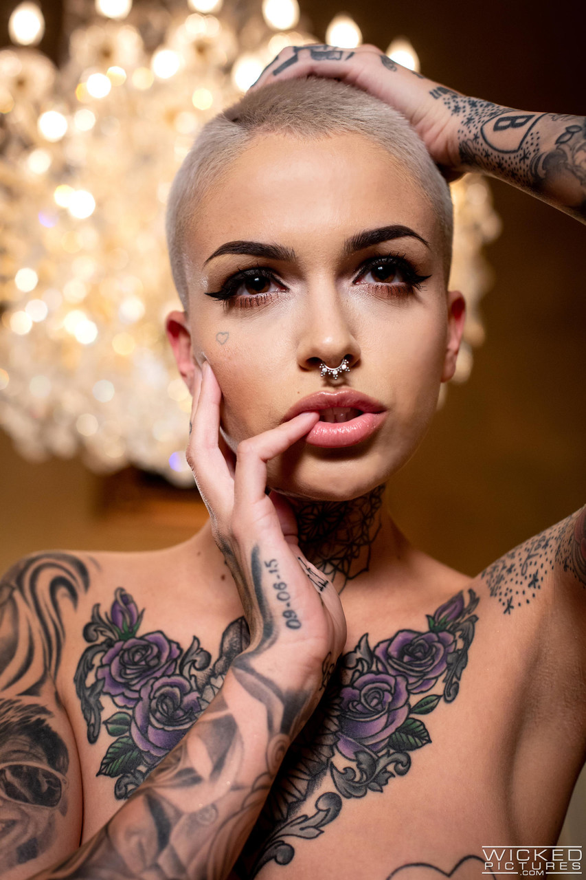 Shaved headed tattooed pornstar Leigh Raven throats & screws a curved dick  - NakedPics