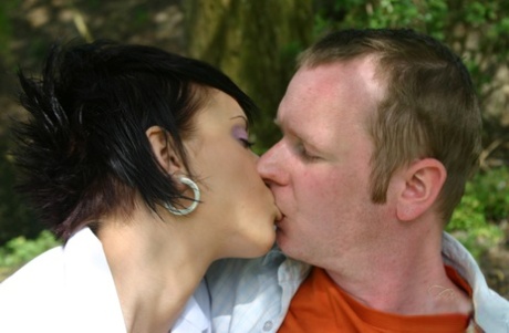 Short haired girl Carmen Blue licks the ball sac while giving an outdoor BJ