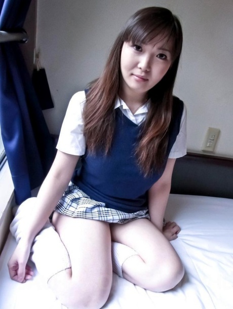 Japanese schoolgirl Haruka Ohsawa uncovers her fully developed breasts