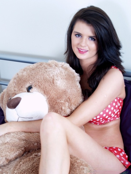 Brunette chick lets go of her stuffed bear to expose her big natural tits