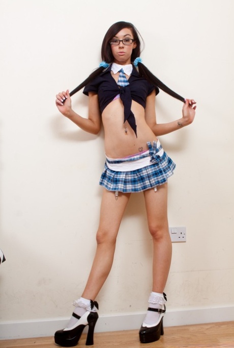 Cute amateur displays her flexibility while removing slutty schoolgirl clothes