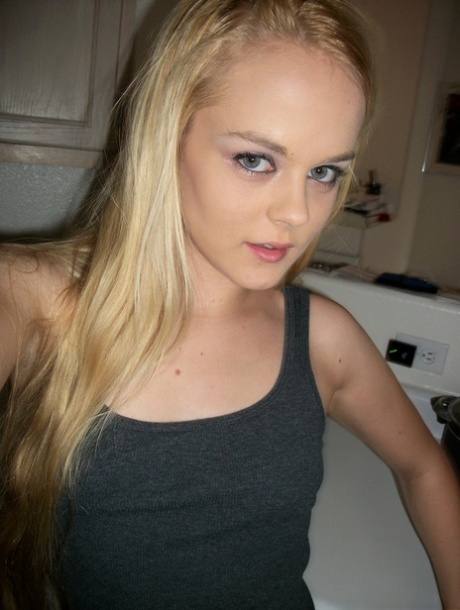 Petite amateur Bri Skies takes selfies while exposing her tits and pussy