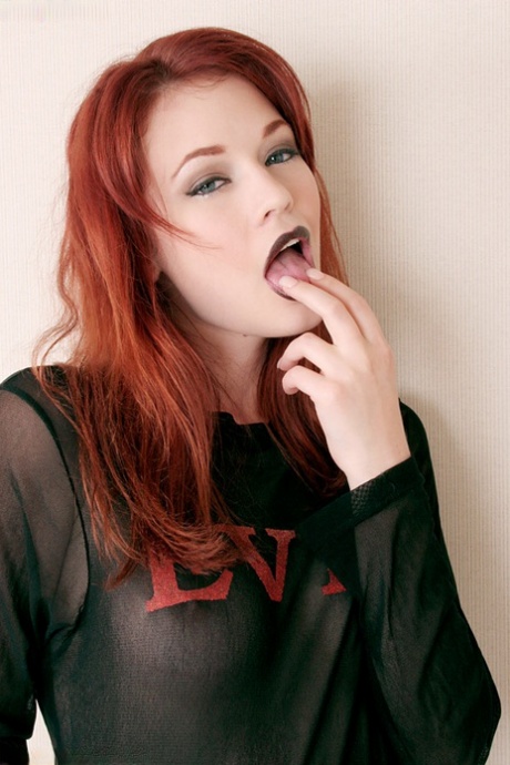 Redhead MILF Justine Joli finger fucks before licking and biting her toes