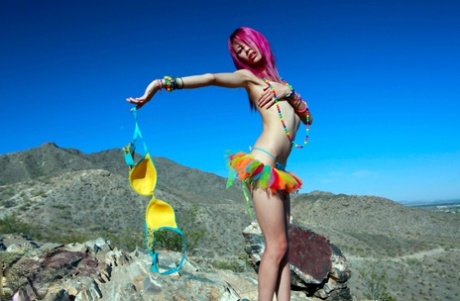 Thin girl with pink hair Laloui takes off her bikini while wearing sunglasses