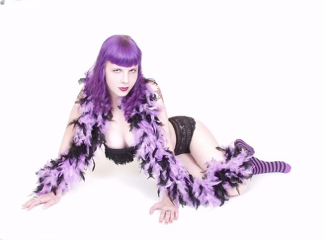 Solo model Szandora goes nude in a feather boa and striped knee socks