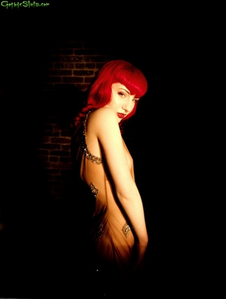Goth girl Angela Ryan sports flaming red hair during a solo shoot
