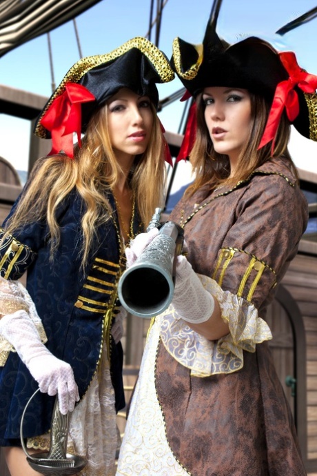 Female pirates partake in lesbian foreplay while on board a vessel