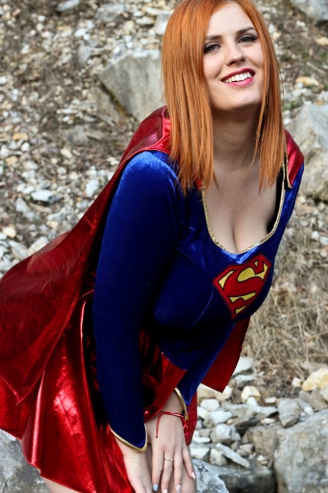 Thick redhead Alexsis Faye releases her giant tits from Superman osutfit