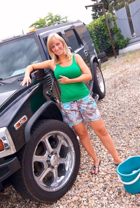 Mature blonde amateur Nikol washed her SUV with her big tits and hot ass bare