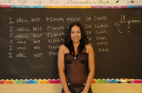 Latina teen Cindy Cupcakes exposes her tight ass in front of a chalkboard
