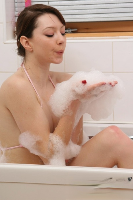 Teen amateur Chloe takes off her bikini in a SFW manner during a bubble bath