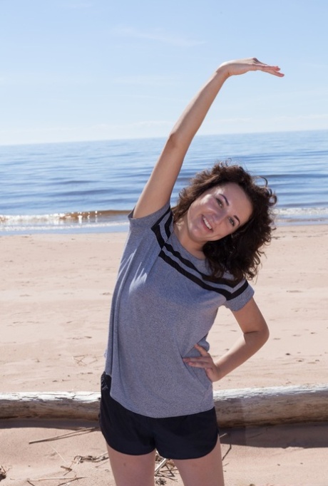 First timer Laimites spreads her hairy twat wide open at the beach