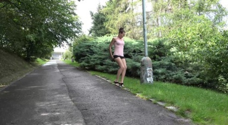 White girl hitches up her skirt to take a much needed pee outdoors