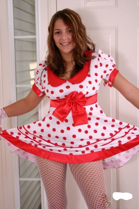 Cute teen Kara exposes white underwear in fishnets and a polka-dot dress