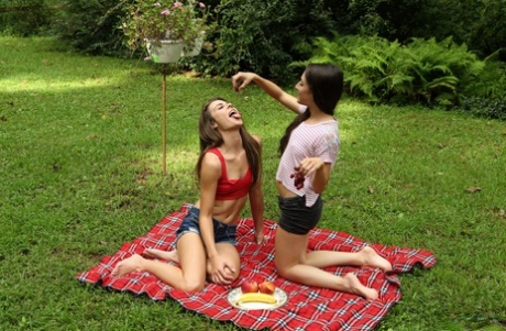 Teen lesbians Freya Von Doom & Ally Tate appease twats in a yard on a blanket