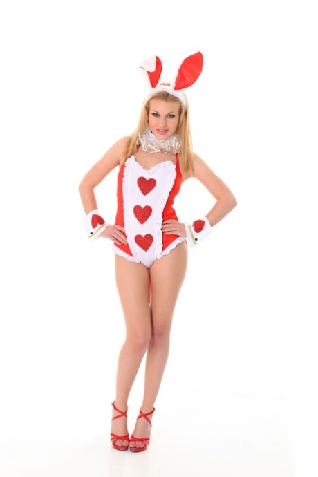 Hot blonde Melissa K takes off a cute outfit to go nude in bunny ears