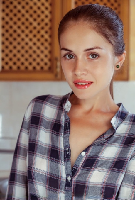 Slim teen Maria Espen disrobes in kitchen before a close-up of her tight slit