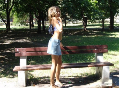 Amateur girl partakes in no panty upskirt action in a public park