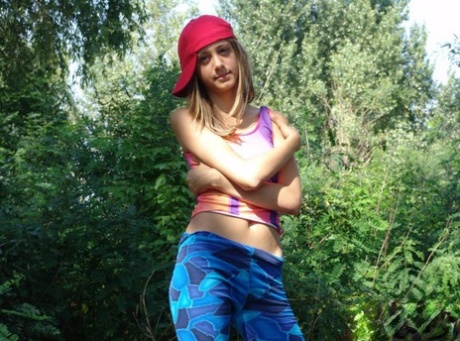 Teen amateur gets naked in the backyard with her ballcap on sideways