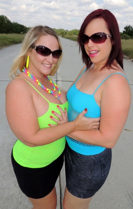 Big assed lesbians Dee Siren and Virgo Peridot lick and fist pussies outdoors