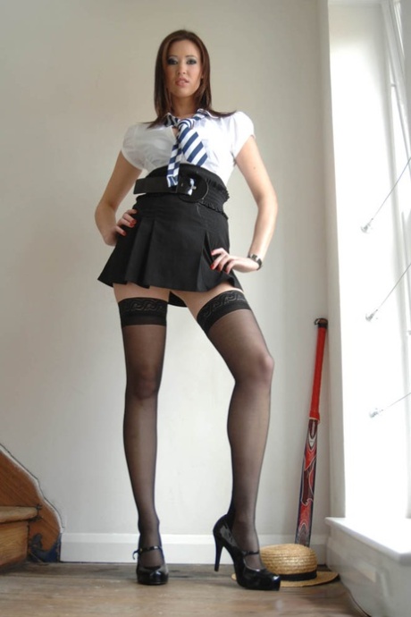 Leggy schoolgirl Carole Hunt holds her great tits after removing her uniform