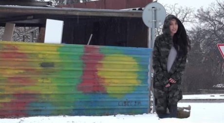 White girl Esperansa takes a badly needed piss on snow-covered ground