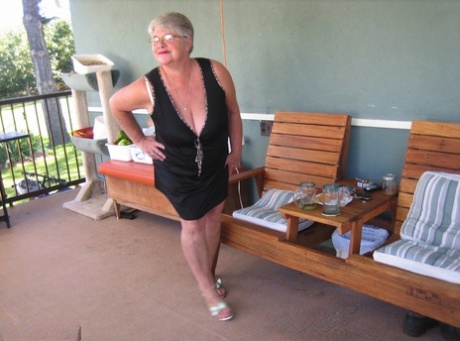 Old lady Girdle Goddess shakes her big butt while on a veranda