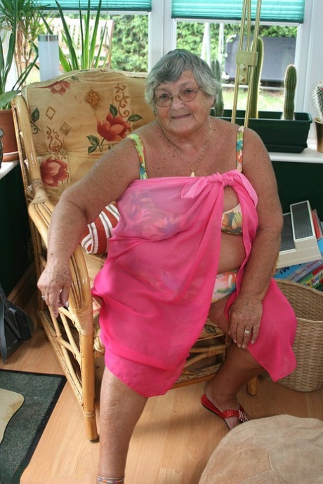 Horny old granny in glasses disrobes to reveal huge saggy tits & big BBW ass