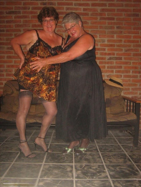 Fat nan Girdle Goddess and her lesbian lover expose their snatches on a sofa