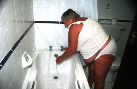 Obese old woman Grandma Libby gets completely naked while having a bath