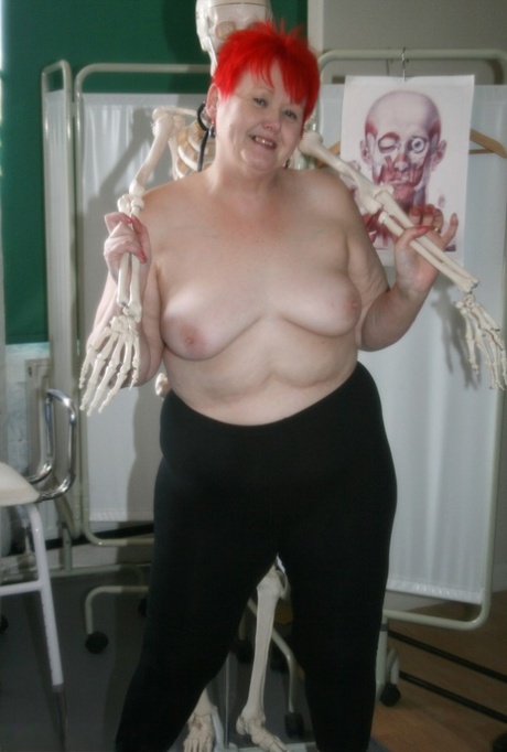 Slutty mature nurse in white stockings gets toyed up by a skeleton