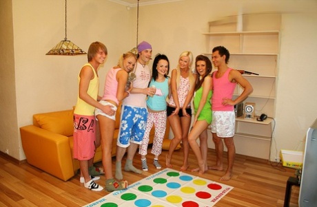 College girls and boys have group sex after playing Twister in the nude