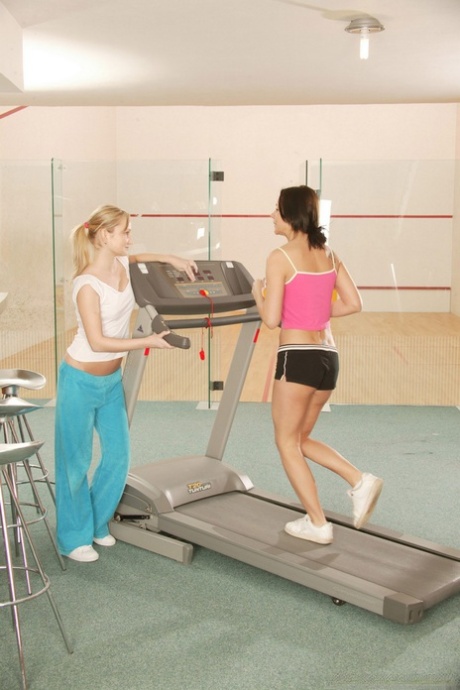 Young lesbians toy their vaginas after a run on a treadmill