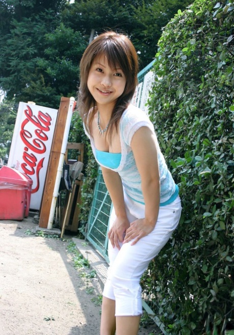 Japanese model Ayumi Motomura bares her tits and ass while changing clothes