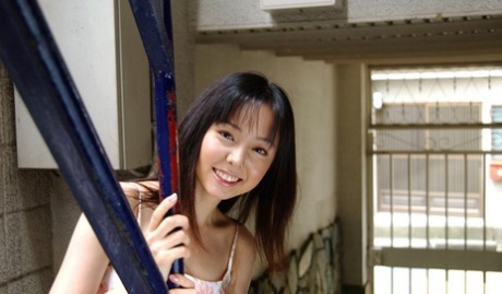 Sweet Japanese teen Yui Hasumi wears a smile while showing her hairy bush