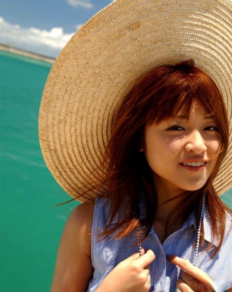 Pretty Japanese teen Asuka goes topless while in the ocean