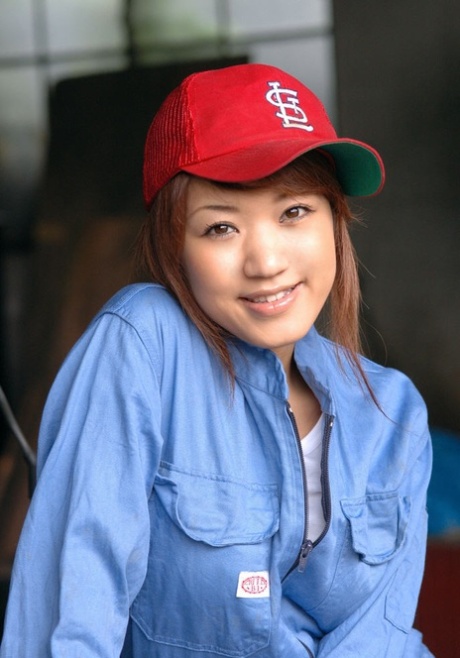 Redheaded Japanese teen Ramu has sex while wearing a baseball cap