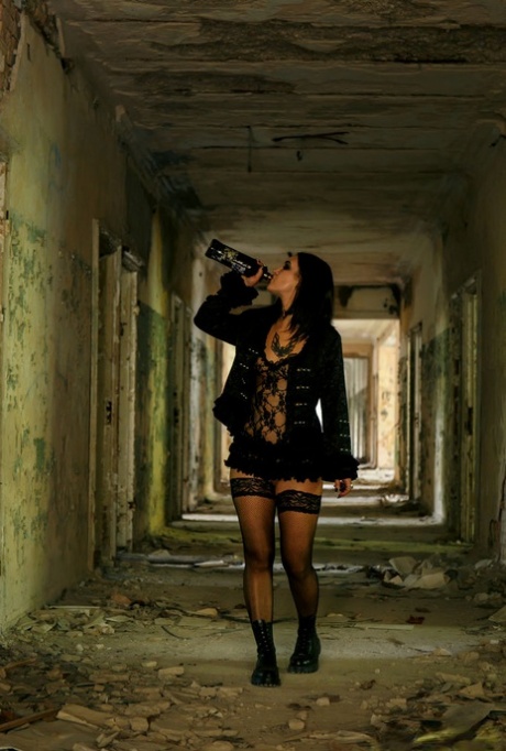 Dark haired chick Lola Ash pisses on floor of abandoned building