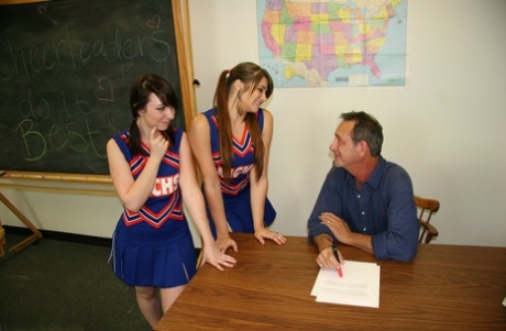 2 cheerleaders jerk off their geography teacher on top of his desk