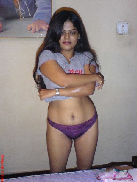 Petite Indian girl uncups big naturals after removing blue jeans