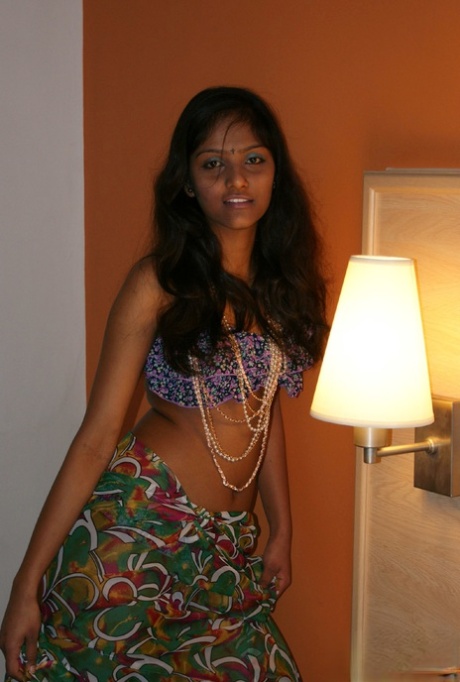 Slender Indian amateur Divya Yogesh exposes natural tits as she gets naked