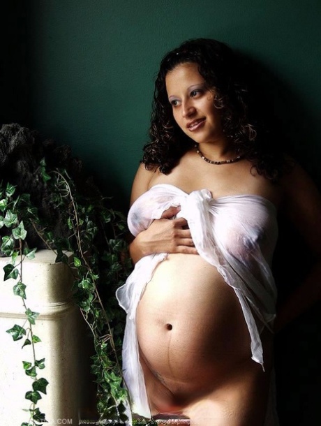 Pregnant Latina MILF drapes her naked body in sheer fabric