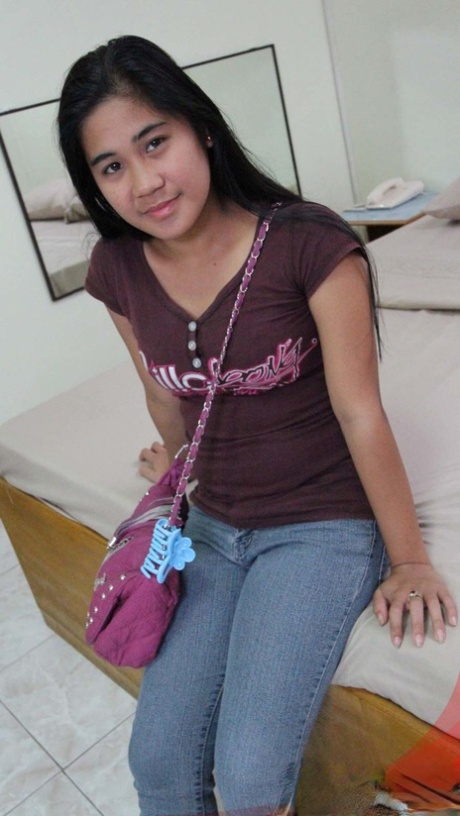 Filipina amateur Maya kneels on her bed after taking off all her clothes