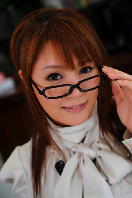 Japanese redhead takes off her glasses and skirt during safe for work action