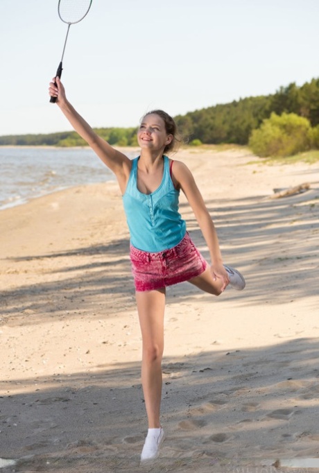 Sweet teen Faina Bona shows her butterfly labia lips after beach badminton