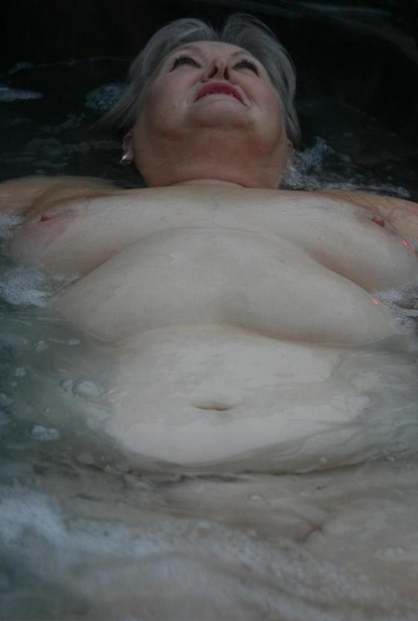 Fat oma changes into nylons and heels after lounging naked in hot tub