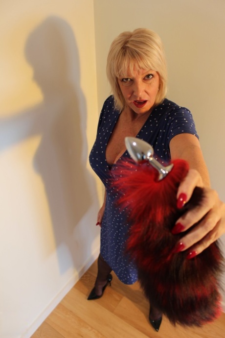 Older blonde sports a fox tail butt plug before fucking a couple of young men